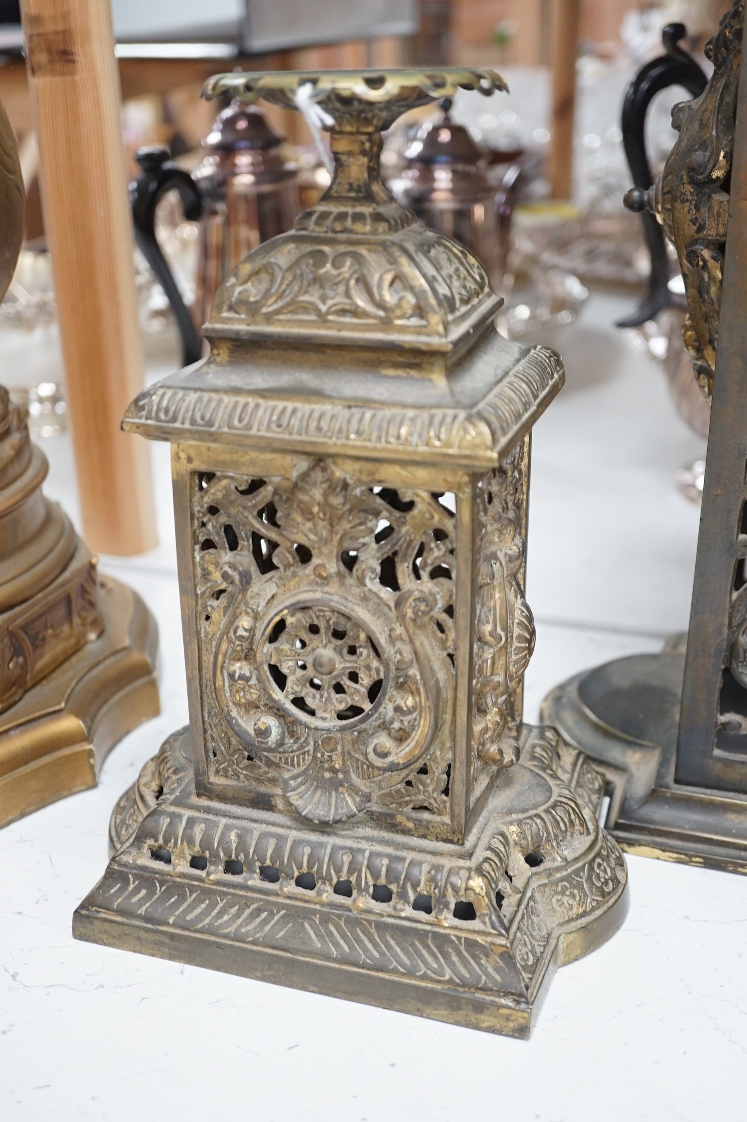 A French brass clock garniture, Comptoir General, 9 Bd Poissenniere, Paris, Maison H. Riondet on an enamel plaque to the dial. Height 42cm